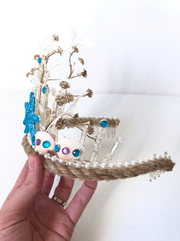 DIY mermaid tiara for Halloween costume, decorated with shells, jewels, and pearls. Check out the DIY Mermaid and Sailor tutorial post for step-by-step instructions. For more DIY and felt crafting inspiration, follow The Felt Habit on Pinterest!