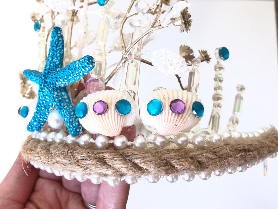 DIY mermaid tiara for Halloween costume, decorated with shells, jewels, and pearls. Check out the DIY Mermaid and Sailor tutorial post for step-by-step instructions. For more DIY and felt crafting inspiration, follow The Felt Habit on Pinterest!